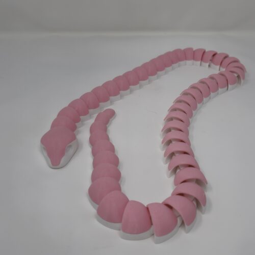 A pink-and-white segmented snake figurine, 3 feet in length, 3D printed by PlastiForge3D using multi-color FDM technology.