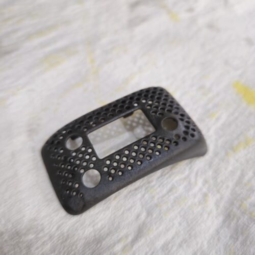A custom 3D printed ImmersionRC module cover designed for an FPV headset, featuring perforated ventilation holes and a lightweight form factor.